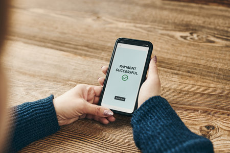 Woman paying with smartphone for online shopping. Paying using fast secure payment system. Woman...