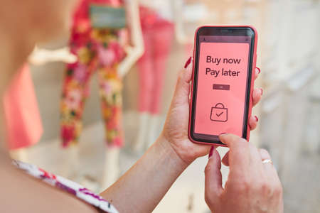 BNPL Buy now pay later online shopping service on smartphone. Online shopping. Paying after delivery. Complete the payment after purchase at no added cost. Payment after credit check. Easy way to shop online. Afterpay serviceの写真素材