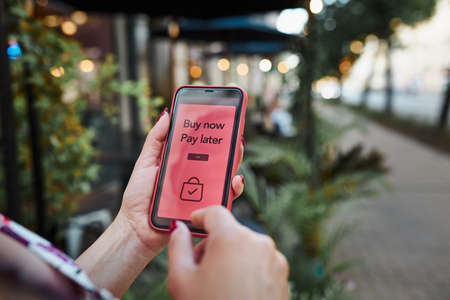 BNPL Buy now pay later online shopping service on smartphone. Online shopping. Paying after delivery. Complete the payment after purchase at no added cost. Payment after credit check. Easy way to shop online. Afterpay serviceの写真素材