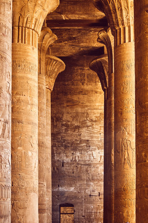 Interior of ancient temple in Egypt. Pillars with Egyptian hieroglyphs. Popular Egyptian landmark....