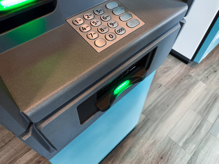 Withdrawing cash at an ATM. Withdraw from bank account using debit card or phone app. Secure banking cash machine. Withdraw cash from cash dispenser. Financial transaction concept. Getting the cash. Polish money. Polish currencyの写真素材