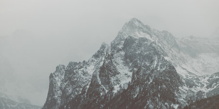 High Tatra Mountains covered in snow. Holidays in Poland. Travel destination. Vacation in Poland. Hiking and skiing in mountains. Tatra National Park. Western Carpathians. Exploration of Poland. Popular tourist destinationの写真素材
