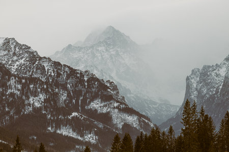 High Tatra Mountains covered in snow. Holidays in Poland. Travel destination. Vacation in Poland. Hiking and skiing in mountains. Tatra National Park. Western Carpathians. Exploration of Poland. Popular tourist destinationの写真素材