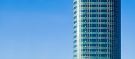 aqua skyscraper on blue skyの写真素材