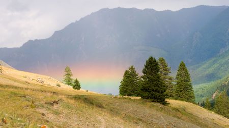 beautiful rainbow in the mountainsの写真素材