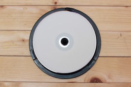 CD drives on wooden background retroの写真素材