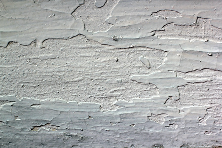 cracked white paint on the wallの写真素材