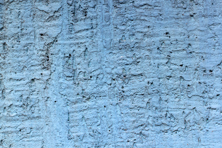 old stone background with cracked blue paintの写真素材