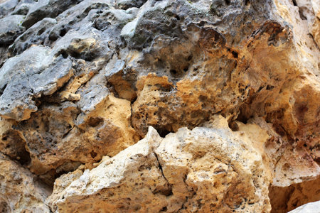 Geological layers of earth - Layered rock background. rock layer sediment. Layer of yellow sand....