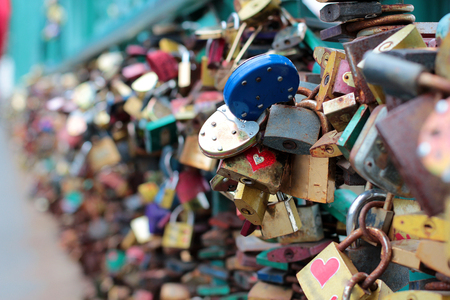Many wedding locks on the bridge in Prague. Beautiful wedding background. Background for wedding photo books.の写真素材