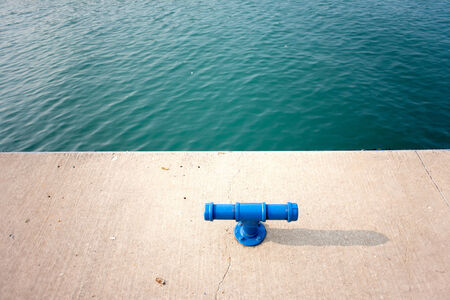 blue metal bollard at the harborの写真素材