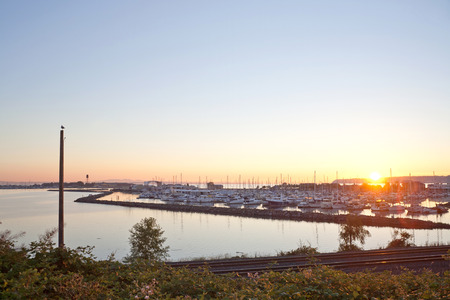 sunset over Blaine harbor with boatsの写真素材
