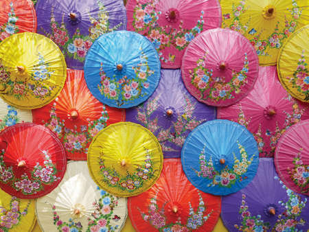 beautiful many colors painted umbrellas as backdrop for taking a photoの写真素材