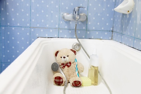 Teddy bear ready to take a bathの写真素材