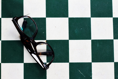 old chess board with chess pieces pilled up togetherの写真素材