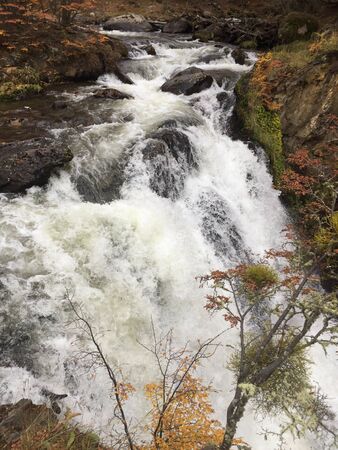 Gorgeous waterfall Ushuaia's Tierra del Fuego in Autumn, Argentina. This place is hidden in the middle of the city.の写真素材