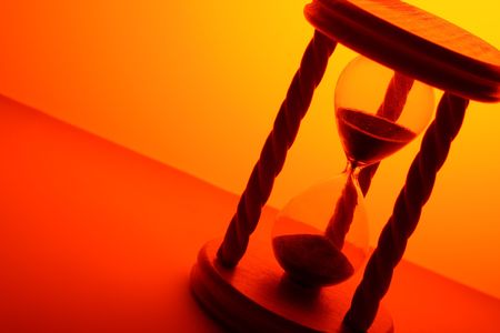 hourglass in orange lightの写真素材