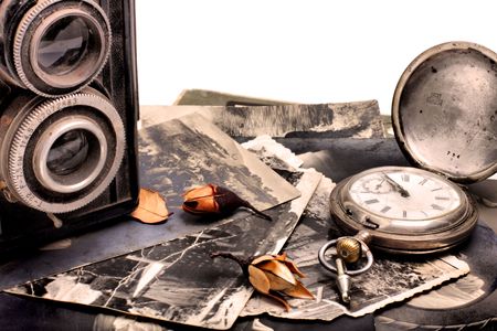 Old photo camera, old pocket watch and old photosの写真素材