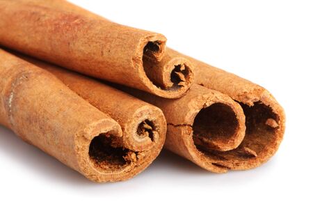 Cinnamon sticks isolated on white background. Shallow DOFの写真素材