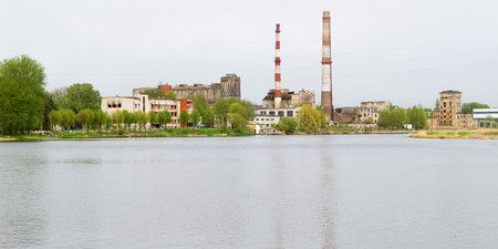 A large old paper mill on the river bank