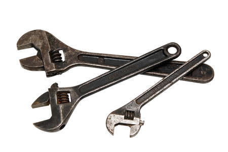 Three old steel wrenches isolated on whiteの写真素材