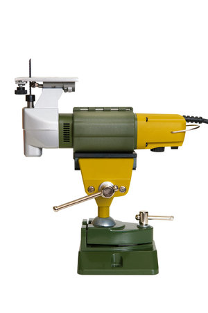 Miniature electric jigsaw for precision work installed in the holder