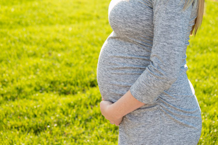 Pregnant expecting woman outdoorsの写真素材