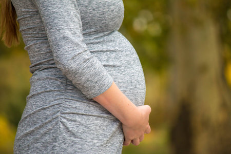 Pregnant expecting woman outdoorsの写真素材