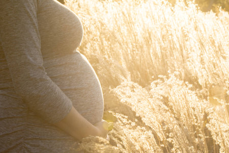 Pregnant expecting woman outdoorsの写真素材