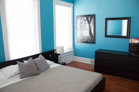bedroom in a modern home with a bedの写真素材