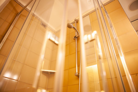 Modern shower with glass cabin inside bathroom interiorの写真素材