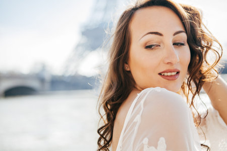 Beautiful girl on the background of the Eiffel tower