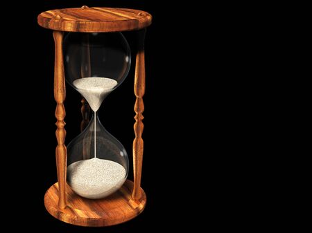 Old hourglass on blackの写真素材