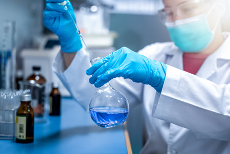 Chemical Advanced Research Laboratory, female scientist is preparing chemicals for the experiment in lab. Research for pharmaceutical, medicine, and biotechnology development.の写真素材