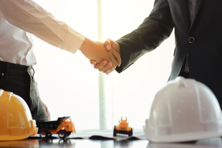 Businessman and engineer handshake for business cooperation.の写真素材