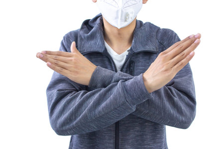 Young man wearing a mask to prevent the spread of COVID-19