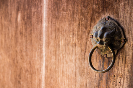 asian metal lion wooden doorknobの写真素材
