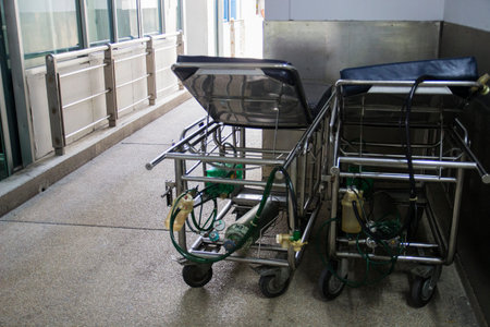 empty hospital bed with oxygen tank