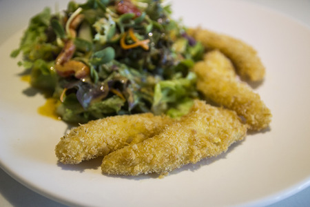 deep fried fish with asian style saladの写真素材