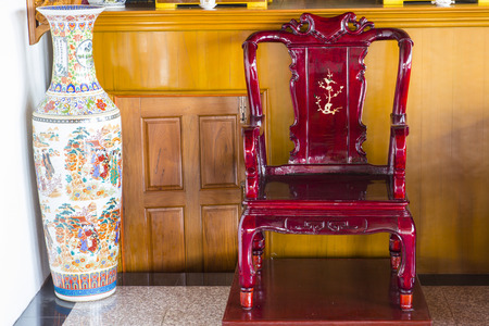 chinese style wood chair and big vaseの写真素材