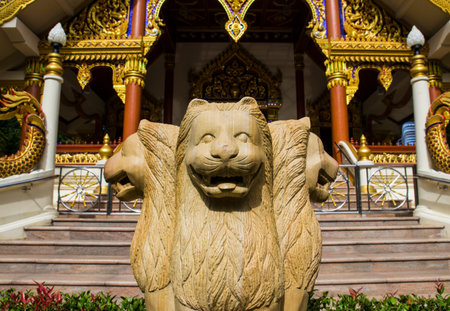 three lion statue in front of asian churchの写真素材