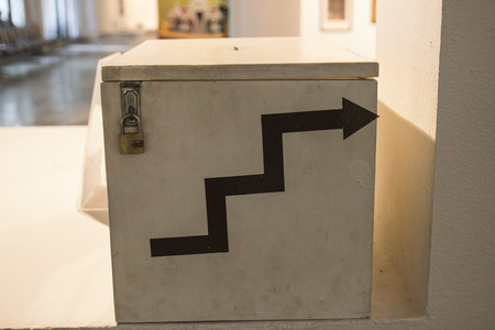 arrow sign for going up the stairsの写真素材