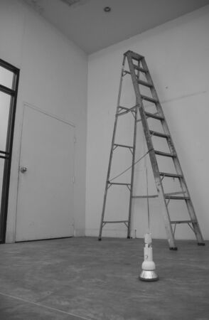 light bulb on the floor in front of the ladderの写真素材