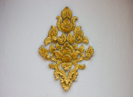 the art of handmade asian golden sculpture tracery for decorating on the white wallのeditorial素材