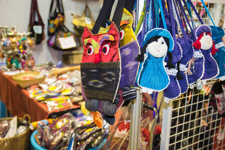 CHIANGMAI, SEPTEMBER 21: The handmade fabric handbags hanging in a shop at Lanna expo organized at Chiang Mai International Convention
and Exhibition Center on September 21,2014 in Chiangmai, Thailandのeditorial素材