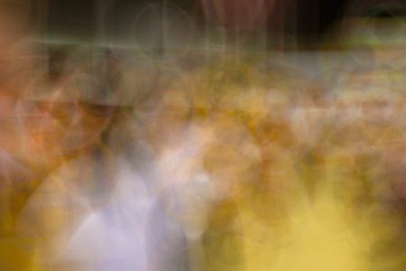 the blurry image of yellow,orange and purple color tone abstract for backgroundの写真素材