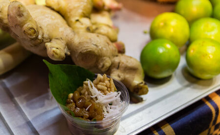ginger, lemon ,lemongrass  and coconut which are the ingredient for thailand traditional sweet snack called miangkumの写真素材