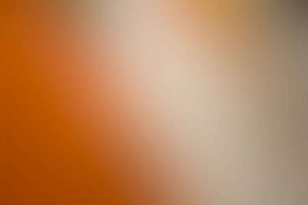 the blurry image of orange and cream color tone abstract for backgroundの写真素材