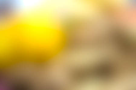 the blurry image of yellow and beige color tone abstract for backgroundの写真素材