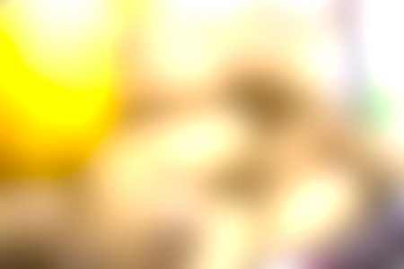 the blurry image of yellow and brown color tone abstract for backgroundの写真素材